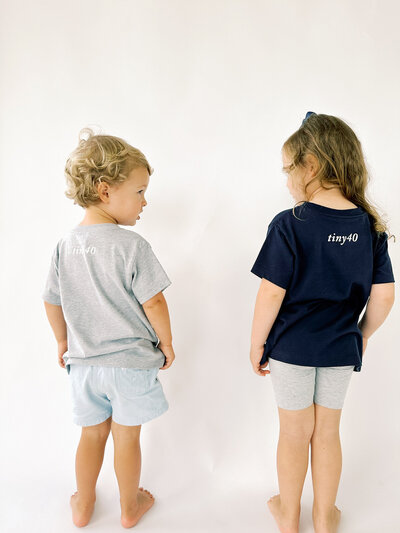 back of toddlers wearing tiny40 shirts