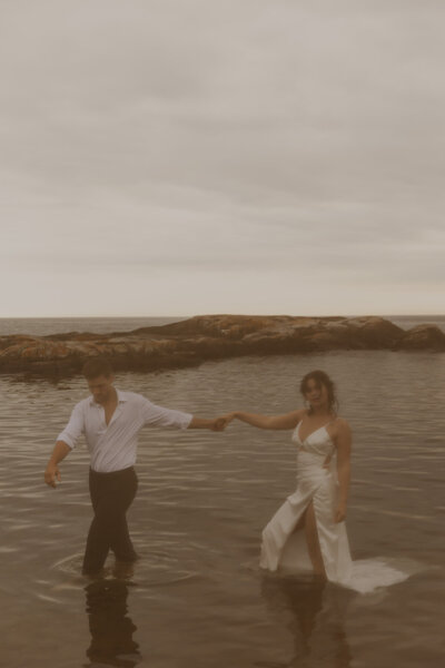 MN North Shore Elopement Bride and Groom in Lake superior photographed by Hailey Haxton a MN Destination Wedding Photographer 
