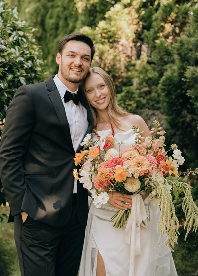 couple smiling in a garden wedding
