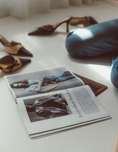 Creative flat lay of a fashion magazine and fashionable heels