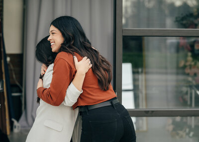 Jessica hugging client