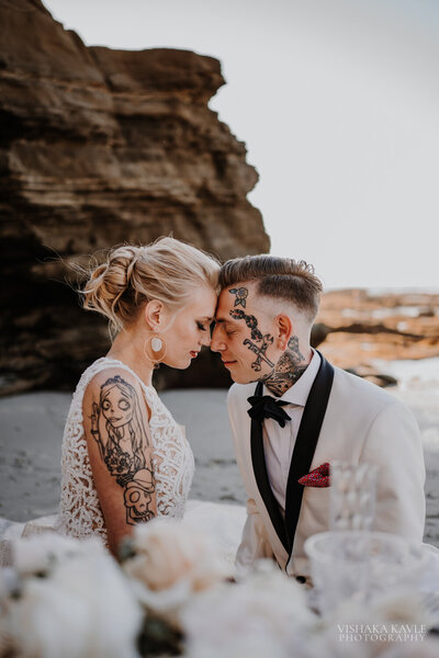 bride and groom touching their foreheads together
