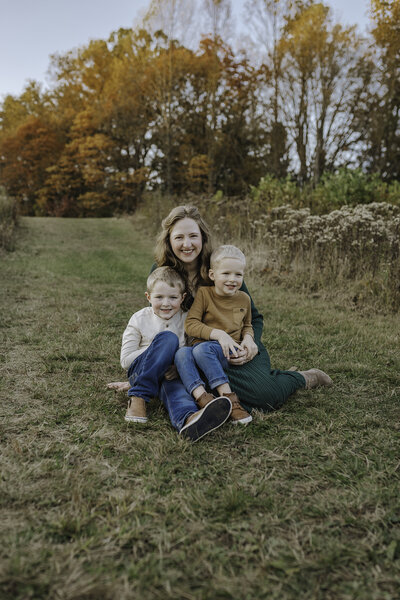 Verona B Photography captures a beautiful fall family photo on of a mom and her boys at Kendall Hills in Peninsula, OH. The fall colors were really at peak color and the sun was perfect for this family photo session near Akron.