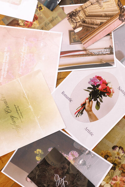 images of brand logos and floral designs laying on a desk