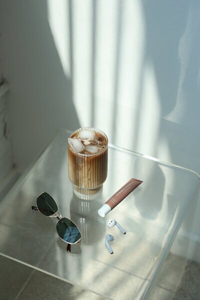 A cup of coffee on a table, symbolizing the work of a Showit website designer.