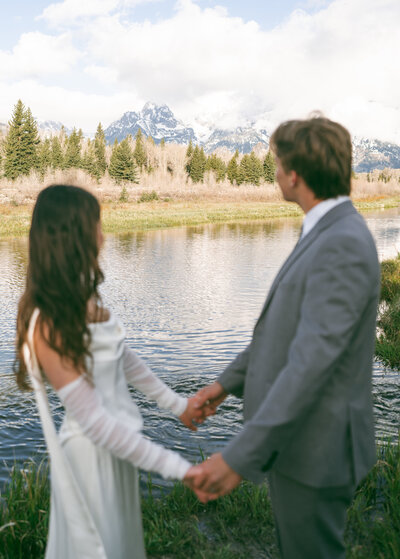 grand tetons elopement, bride and groom share at schwabacher's landing