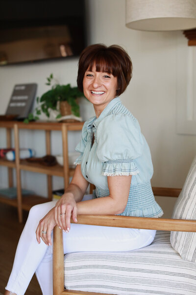 woman smiling at a cafe