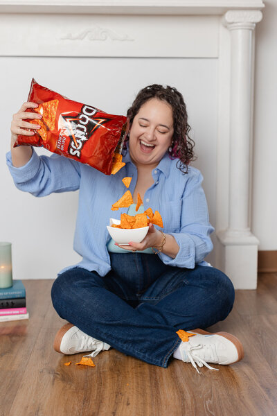 woman puring Doritos into a small bowl