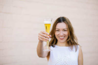 Nelia-40 toasting champagne