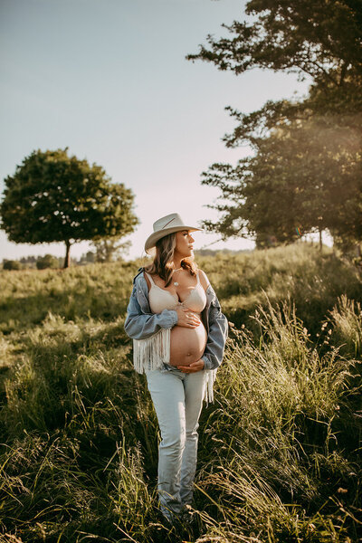 Mother enjoying her pregnancy in a park in Waterloo, Ontario.