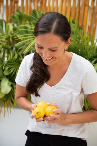 women holding lemons