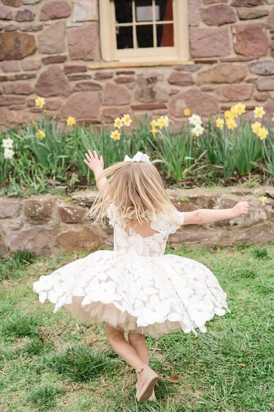 girl twirling taken by a Gainesville, VA family photographer