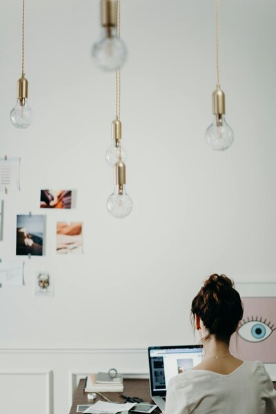 girl working on laptop at desk