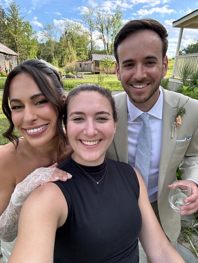 Rebecca Schwartz and bride and groom taking a selfie