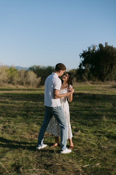 David and Elizabeth dancing in a field in Murrieta.