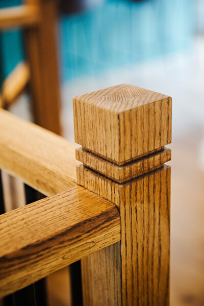 Close up of a custom oak wood stair railing