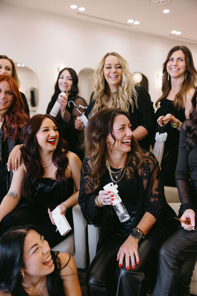 Salon team of happy thriving hairstylists in texas