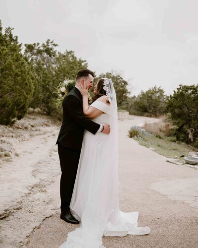 Bride and groom have a moment to themselves after walking down the aisle as one at Chapel Dulcinea in Austin, Texas