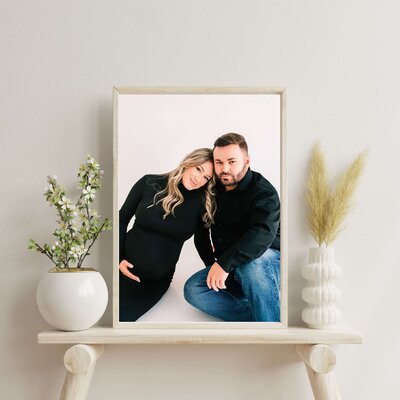 framed maternity photo of couple over chair captured by Springfield MO maternity photographer