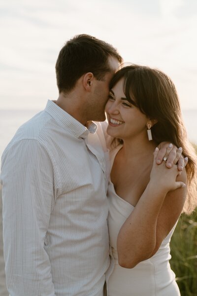 couple hugging at beach photoshoot