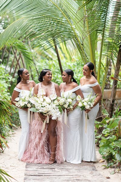 A black bride with her bridesmaids in Tulum, Mexico