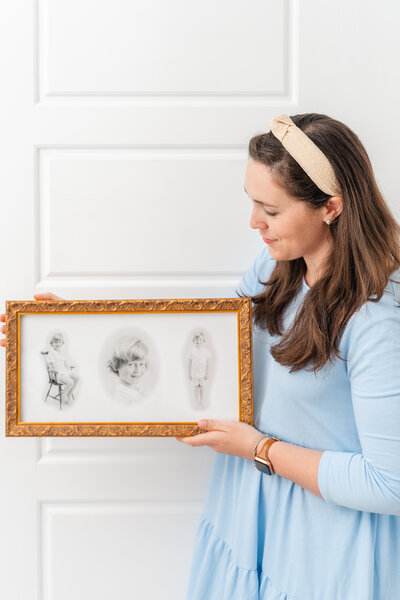 Chattanooga Photographer holds wall art from Heirloom Portrait Session