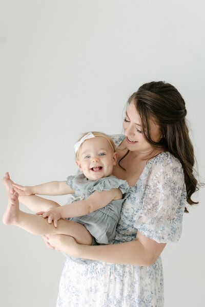 a mom playing with her baby