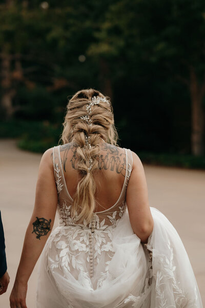 bride walking while holding train