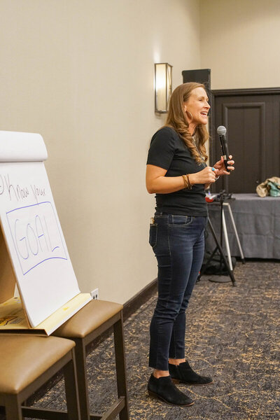 Krystal Proffitt podcast coach speaking on stage