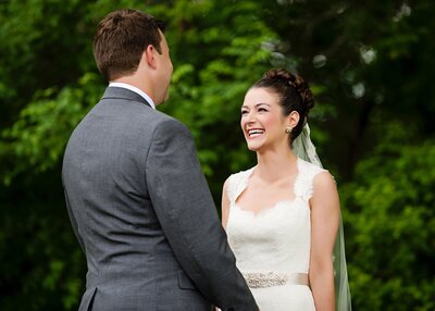 bride with long veil over groom