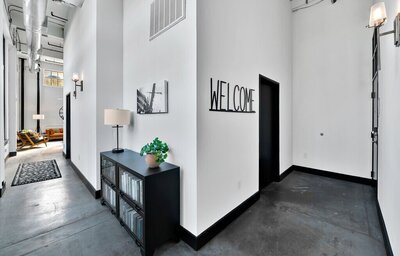 Entrances to this one-bedroom, one-bathroom luxury rental condo in the historic Behrens building in downtown Waco within walking distance to the Silos, Baylor, and local museums.