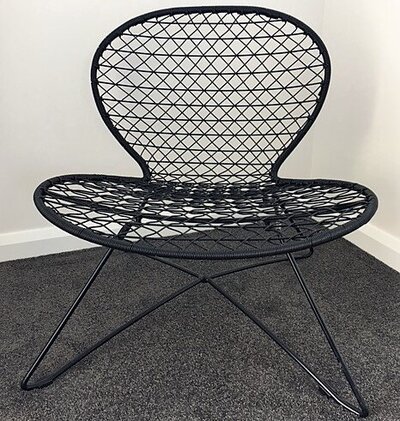 Black plastic low chair