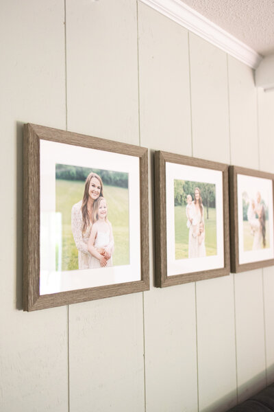framed photographs hanging on a wall