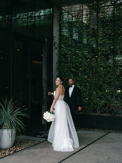 Bride and groom walk up memorial steps at their DC wedding