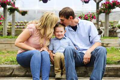 Parents kissing son's head | Family Photos