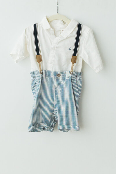 seersucker shorts with suspenders and white collared shirt