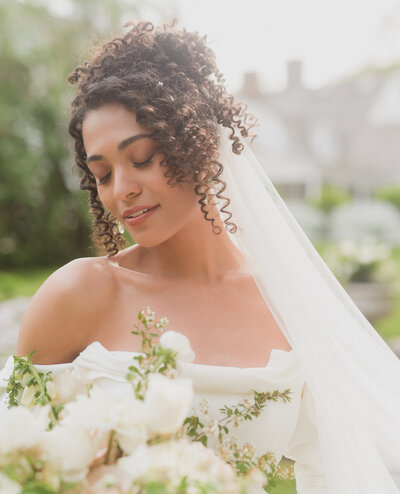 stunning black bride of color bridal portrait with flowers.