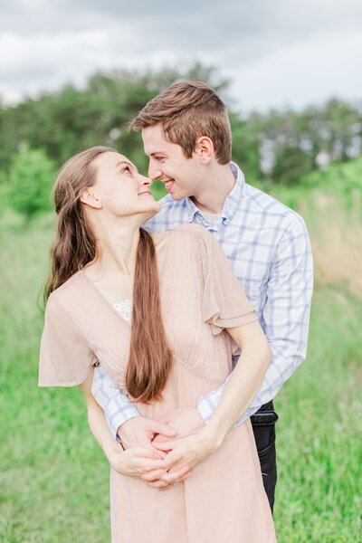 Virginia Wedding Photographers, Jennifer and Daniel Cooke wearing bright summer clothes and smiling at each other