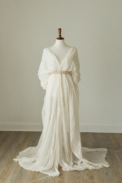 romantic style dress built out of white draped fabric