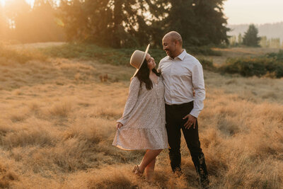 Father and daughter in the golden hour sun in a field located in Woodinville