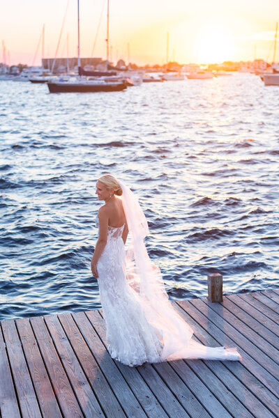 bride on dock at sunset in Rhode Island