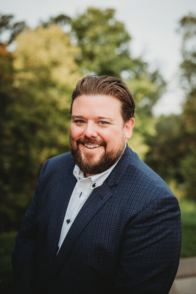 Polished LinkedIn headshot taken in natural light in St. Paul