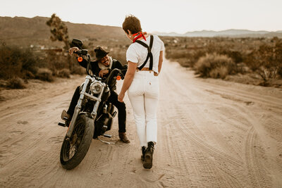 couple on a motorcycle in the desert