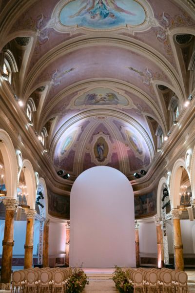 Cathedral style ceremony venue decorated with lush florals in San Francisco, California