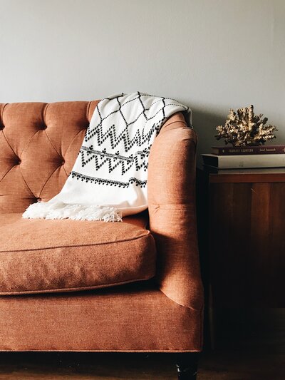 A couch with a blanket