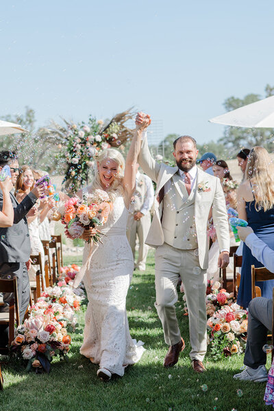 A couple recessing down the aisle at Willow and Oak Estate in California