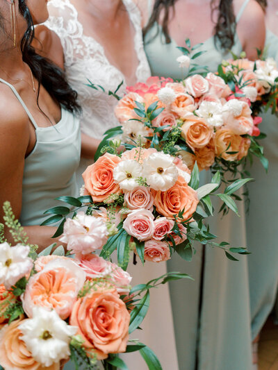 Unique peach, blush and white bridesmaids bouquets. Maryland wedding florist specializing in Eastern Shore wedding venues.