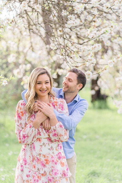 couple got engaged in Brisbane sunflower field girl holding ring kissing boy