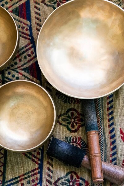 Sound bath instruments laid out on a patterned surface