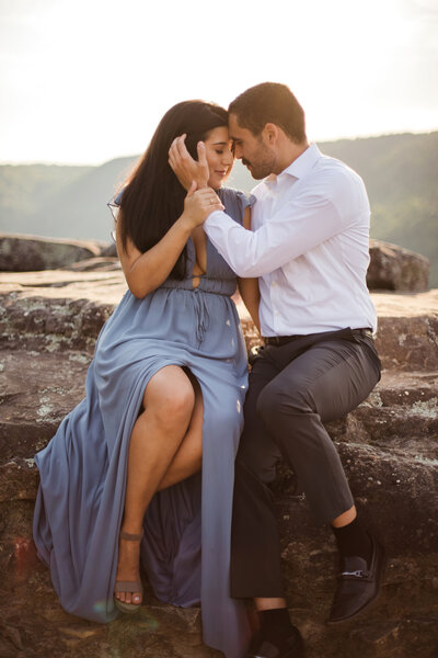 couple hugging on beach during engagement session